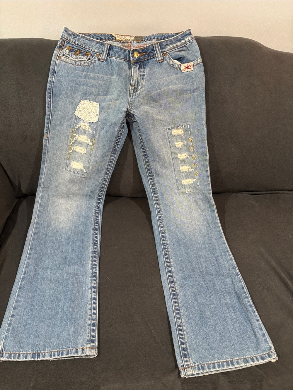 American Rag Light Blue Flare Jeans with Distressed Patch Details